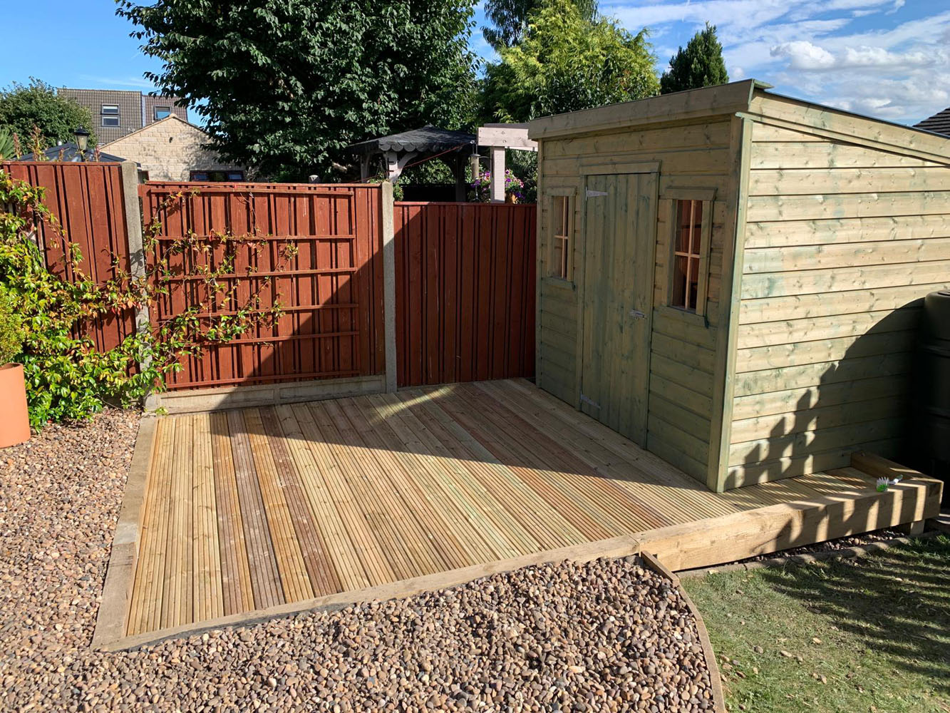 An image of a shed in a back garden.